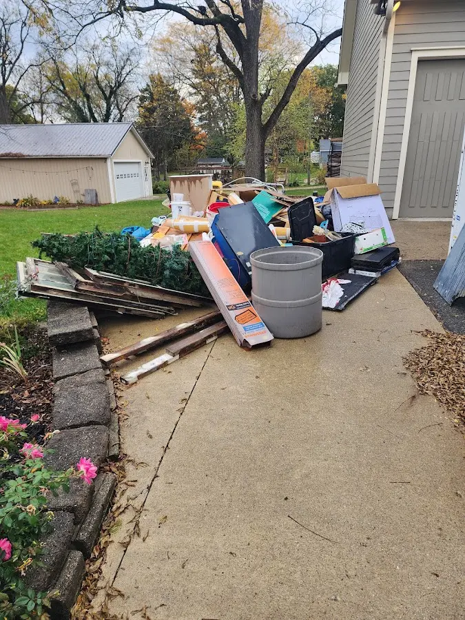 Dumpster being loaded with debris for Residential Dumpster Rental in Battlefield